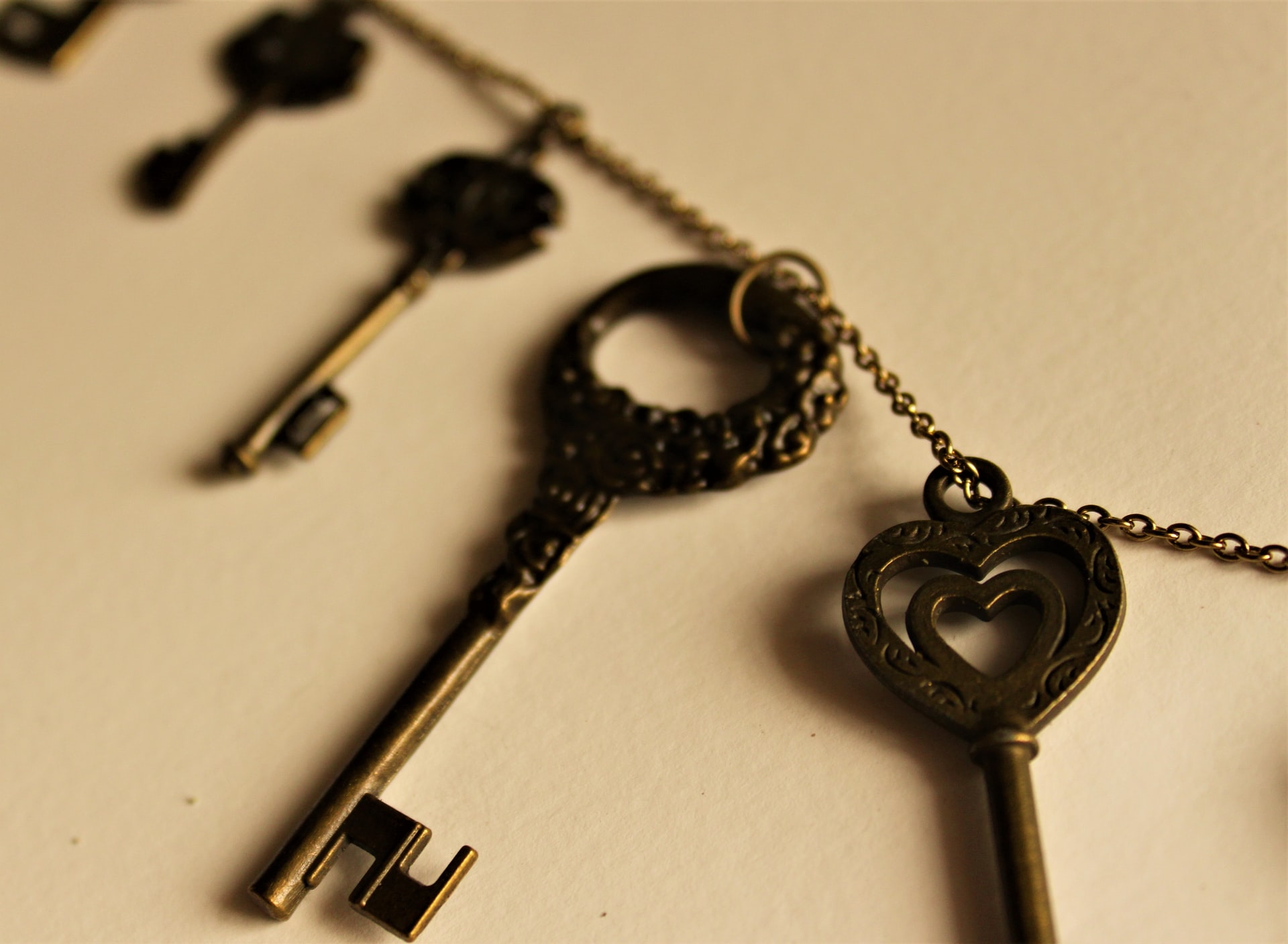 Four decorative keys on chain.