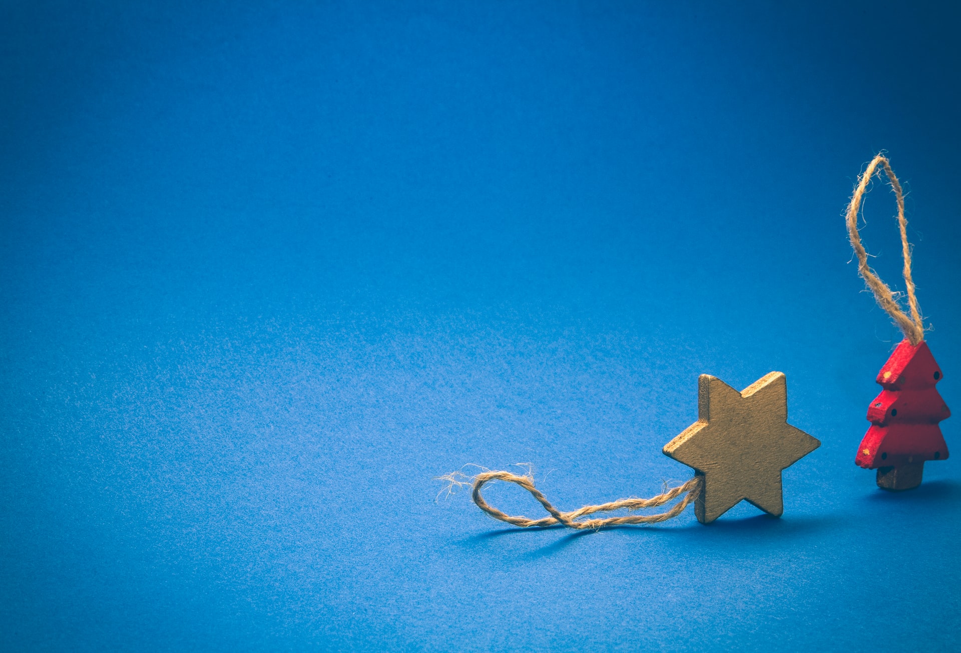 Wooden star and Christmas tree ornaments.