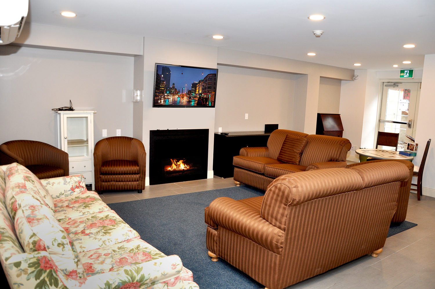 Living room with couch and chairs at renascent Treatment Centre.