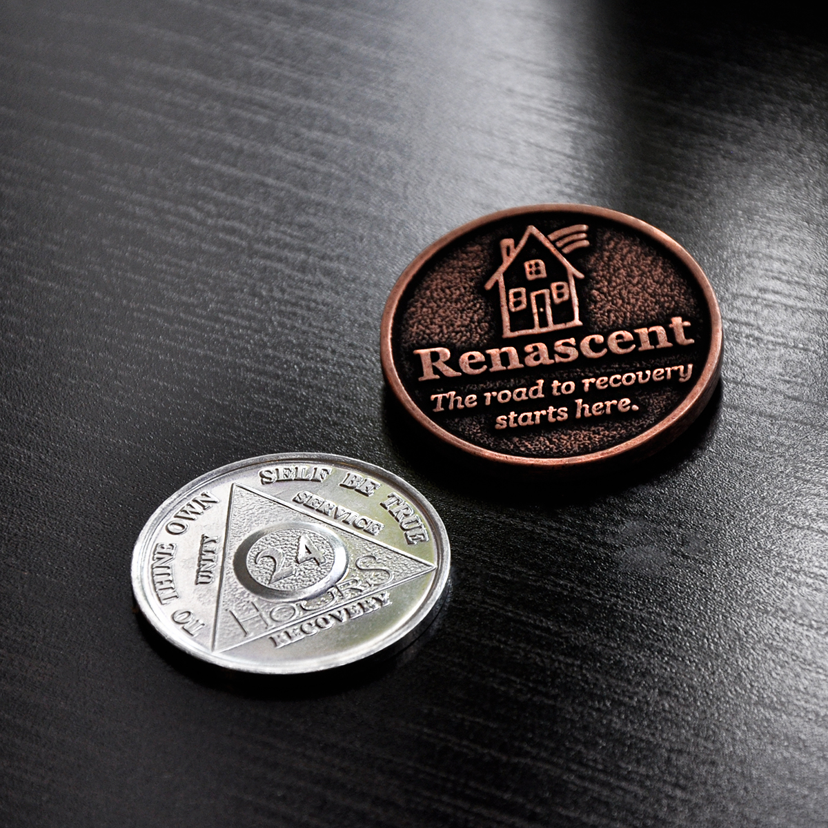 Renascent addiction recovery medallions.