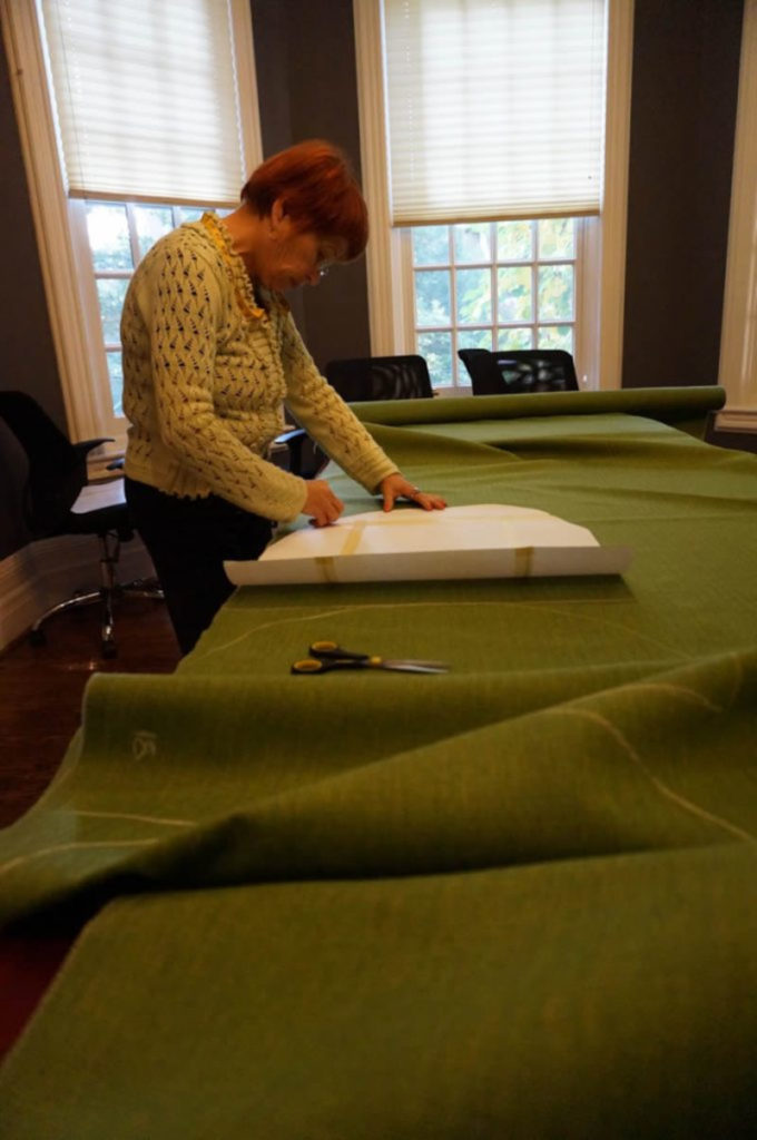 Renascent Addiction Centre volunteer, Susan, cutting out fabric.