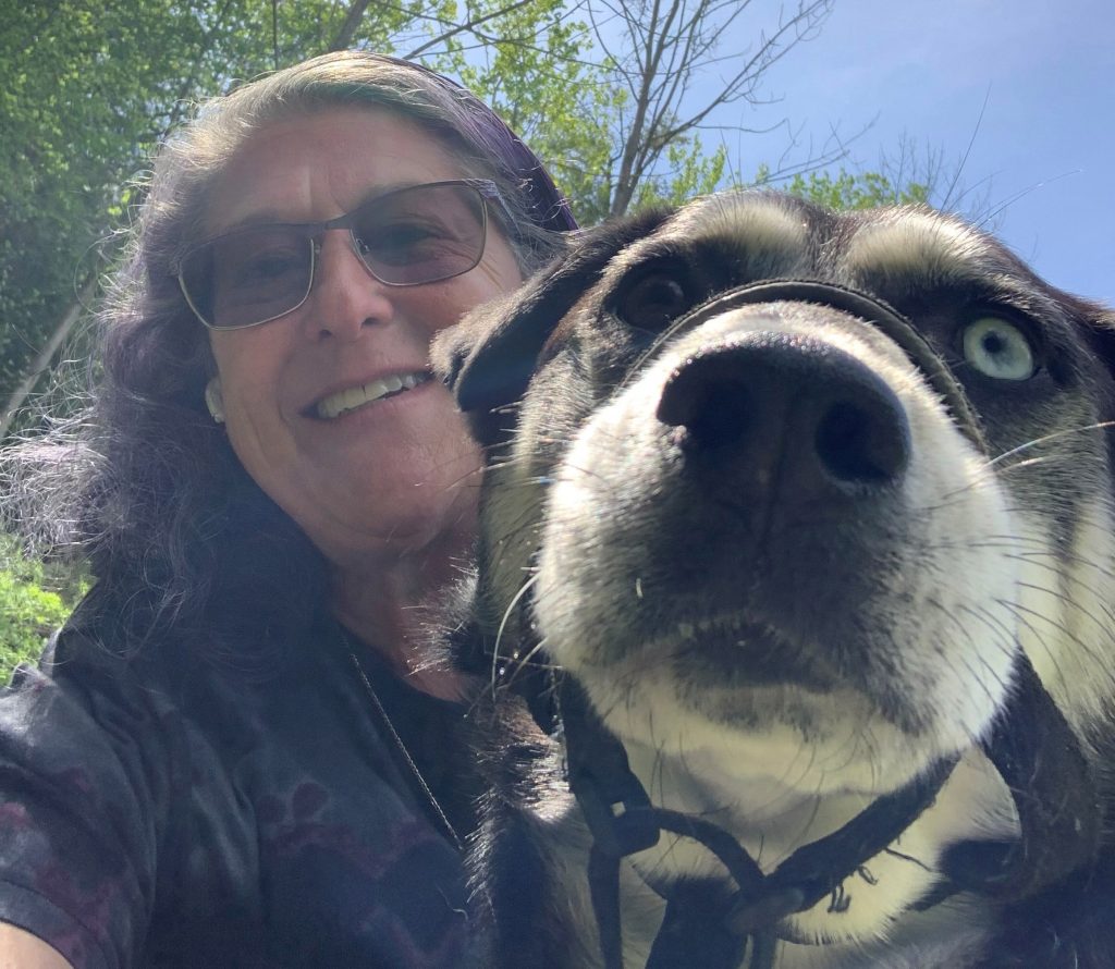 Eileen cuddles her dog