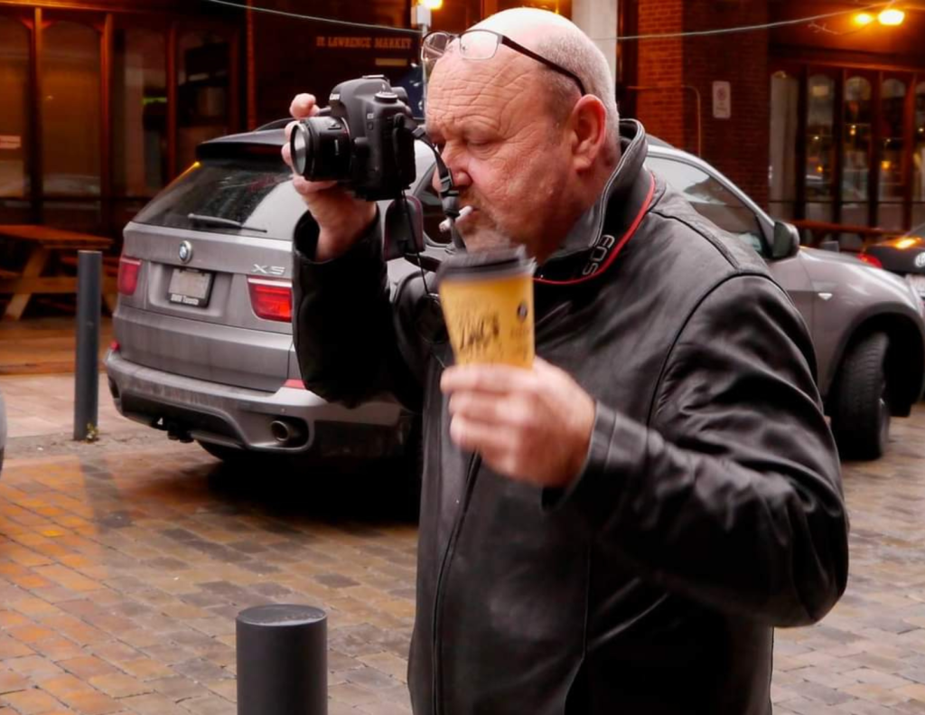 Renascent Alumni, Larry takes a photo