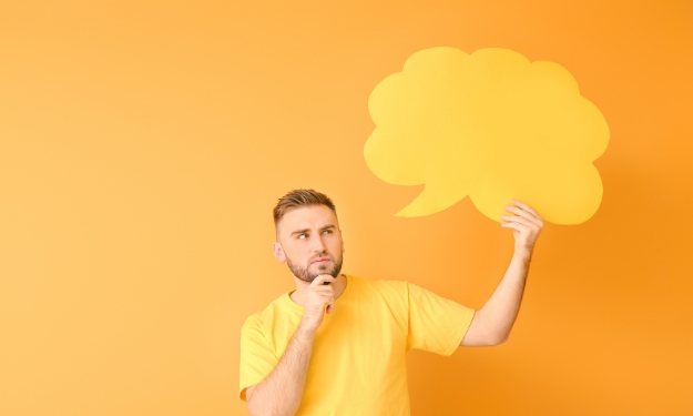 Man with yellow thought bubble