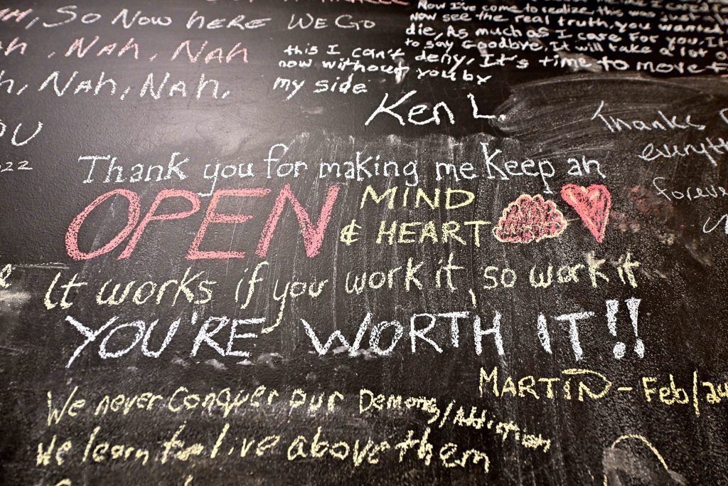 Positive affirmations on chalkboard.
