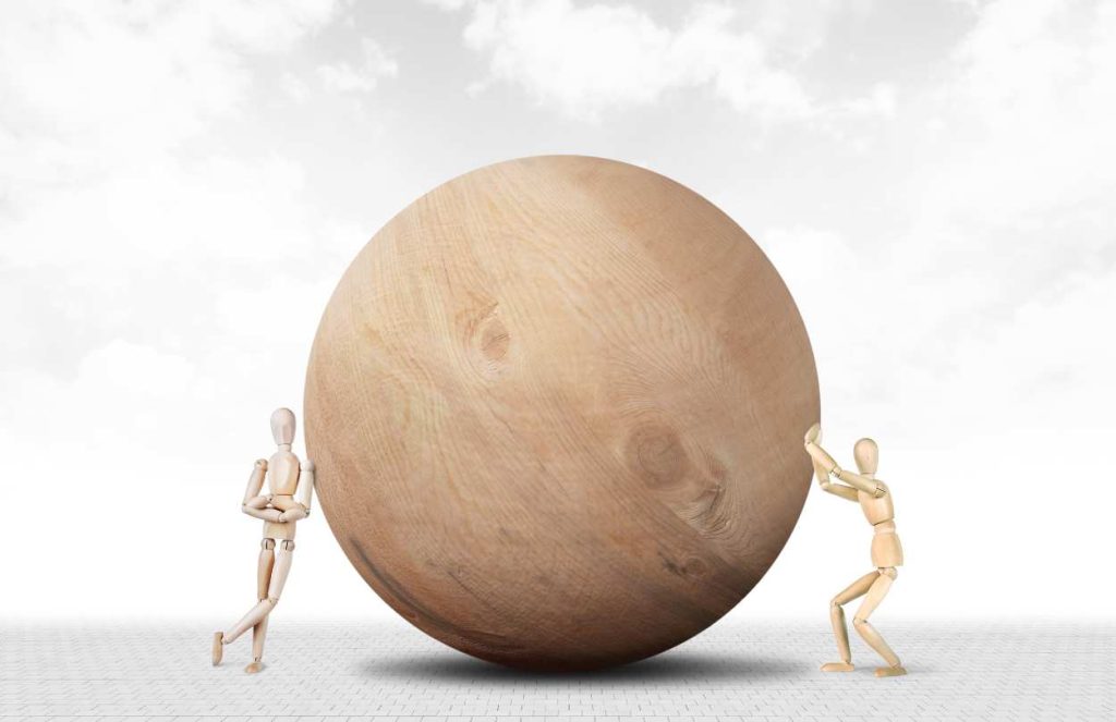 Person pushing a rock