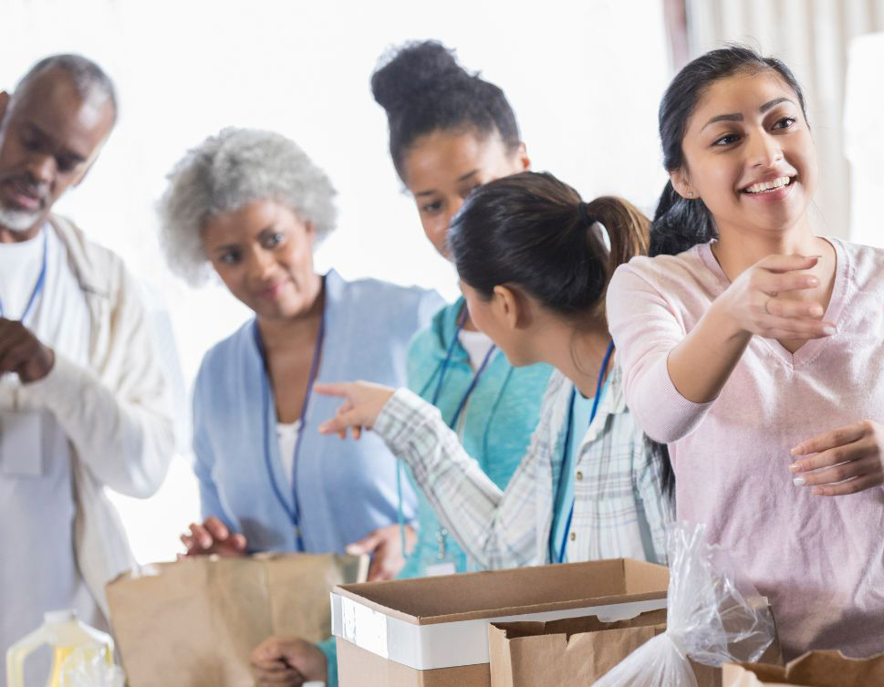 People Packing Items for Charity