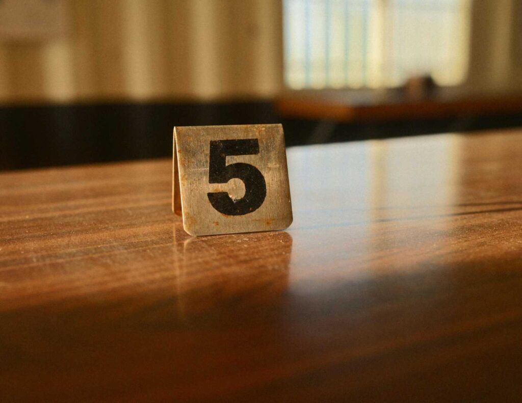 The number 5 on a table.